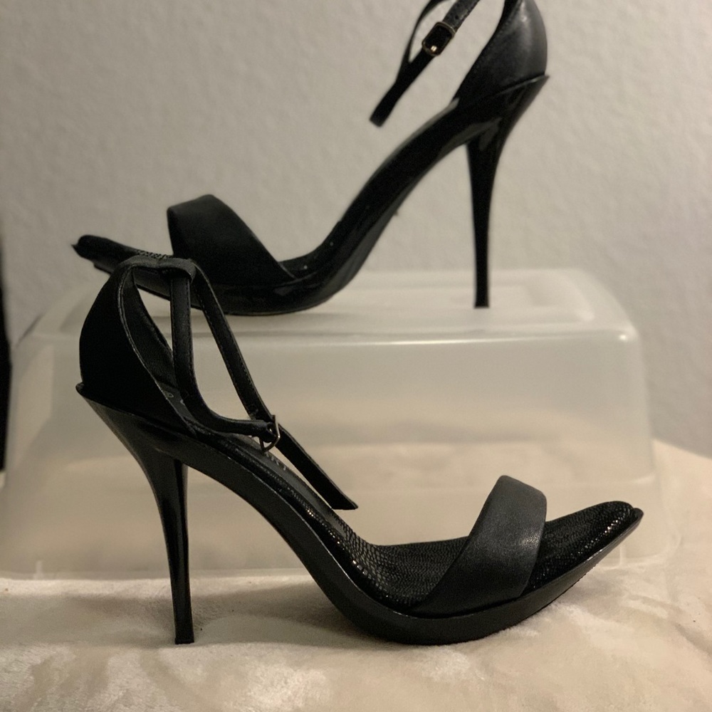 Black ankle strap high heels.